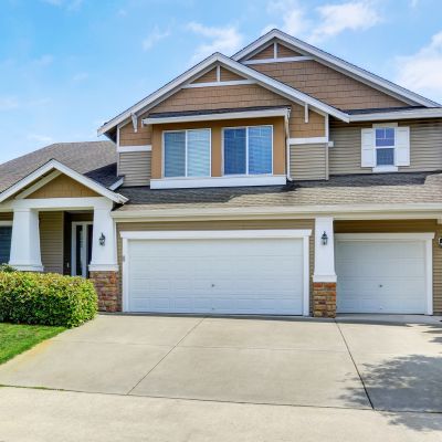 Classic American house exterior with siding trim and garage